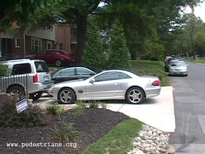 Cars overflow driveway